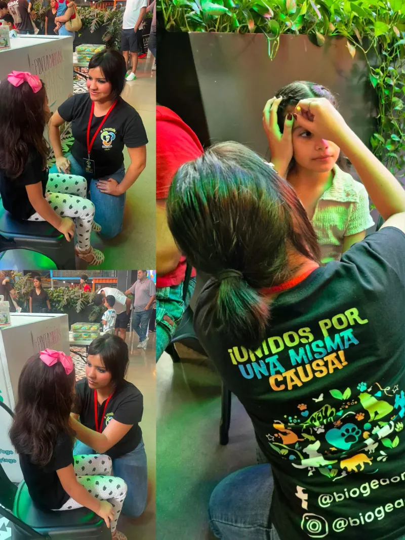 Voluntarias de Bio Gea pintando caritas a niñas durante el Dog Day
